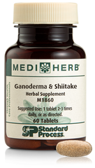 A bottle of Ganoderma & Shiitake herbal supplement next to a tablet.